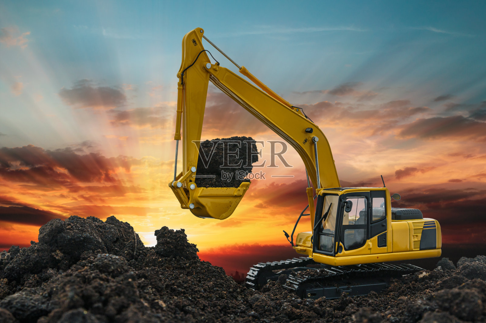 挖掘机正在建筑工地挖土。照片摄影图片