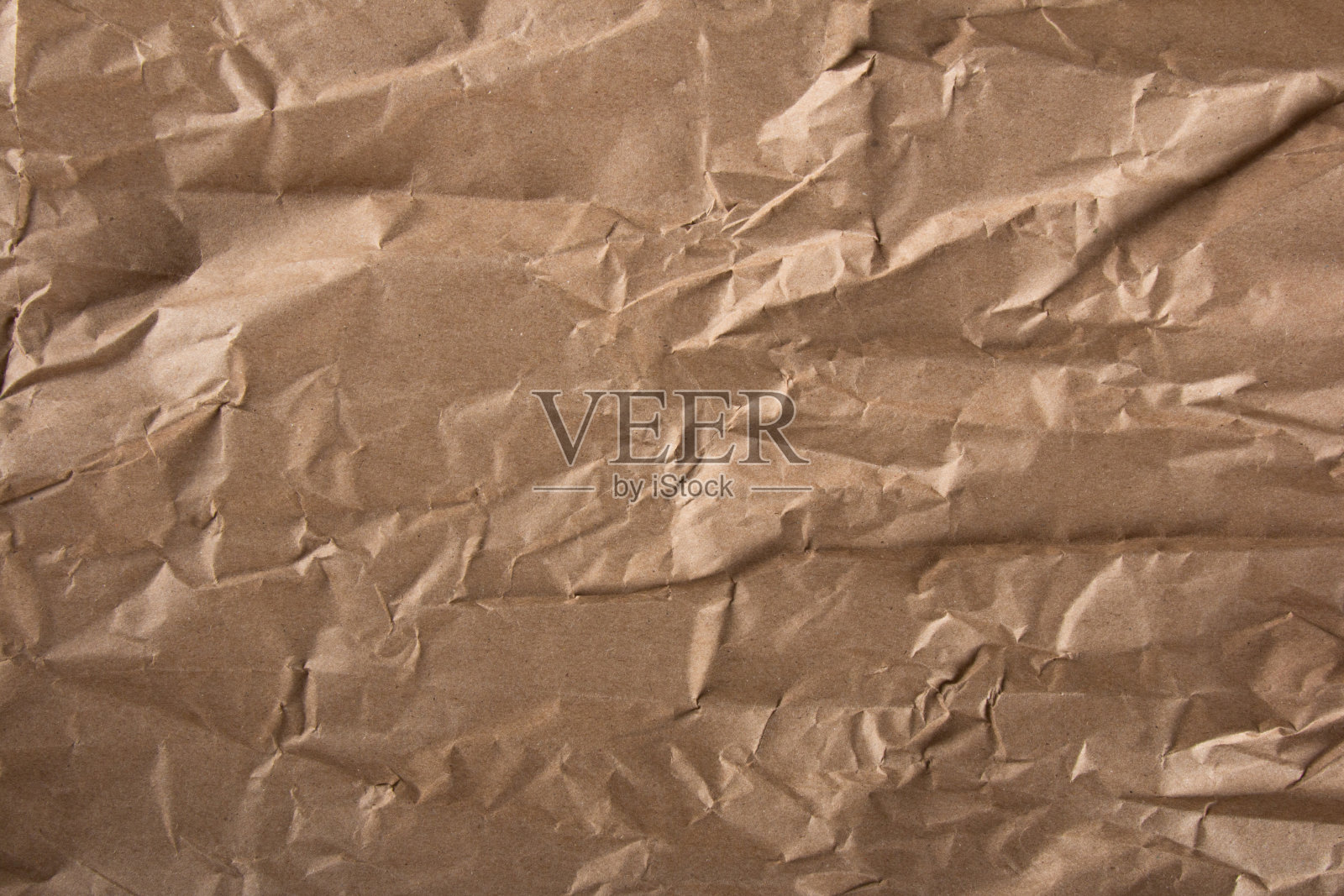 皱巴巴的牛皮纸质感。波浪纹理背景照片摄影图片