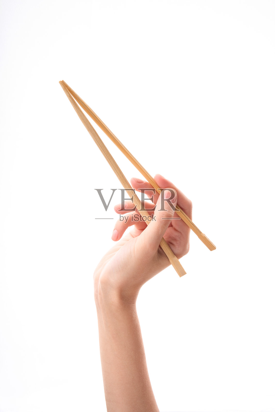 白色背景上的木制筷子。照片摄影图片