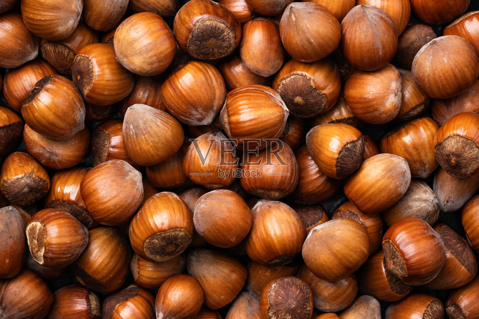 榛子的背景。一堆榛子俯视图。照片摄影图片