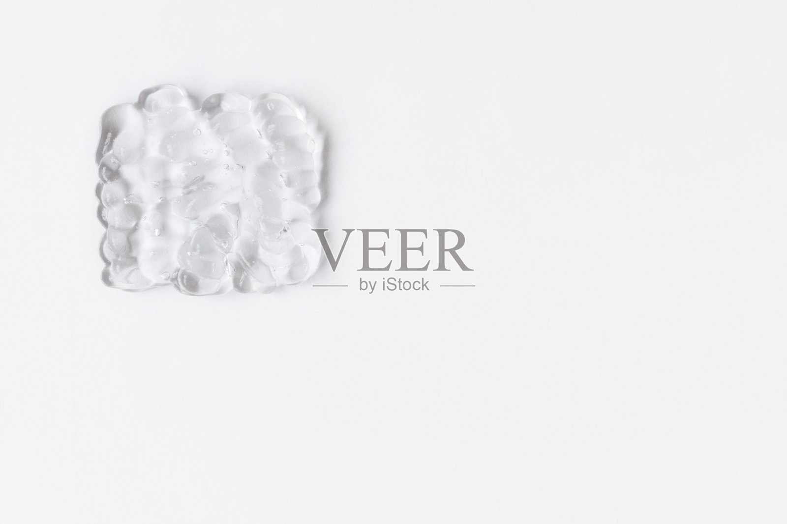 乳剂在白色背景上的凝胶状纹理。清除色板和复制空间照片摄影图片