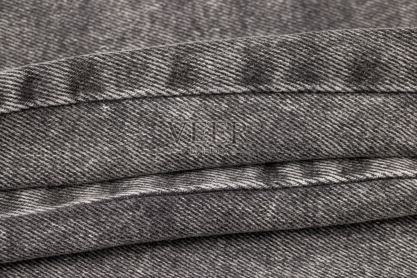 纯灰色牛仔的特写，牛仔裤的特写照片摄影图片