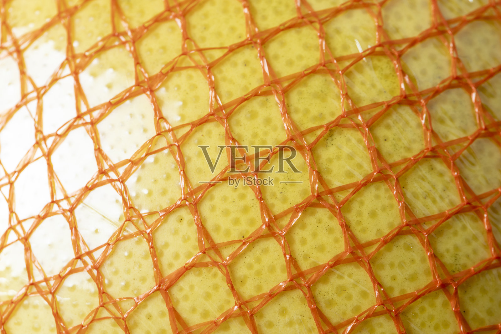 包装在一个红色的网熟黄柚特写照片摄影图片