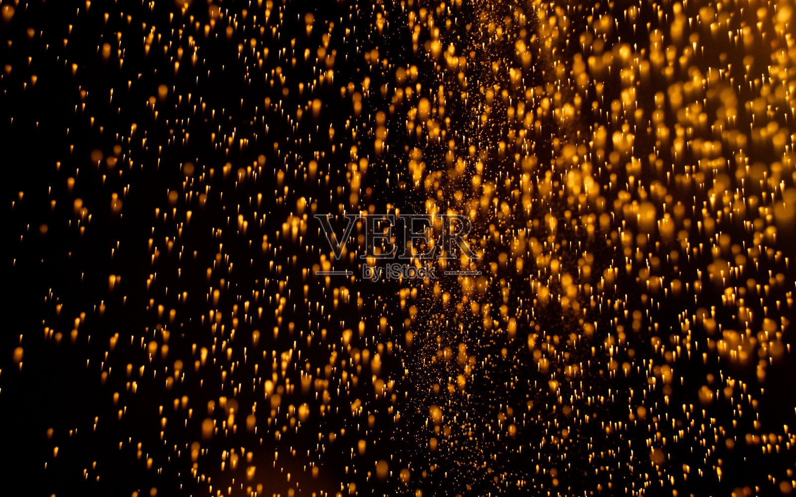 金颗粒下落时的纹理照片摄影图片