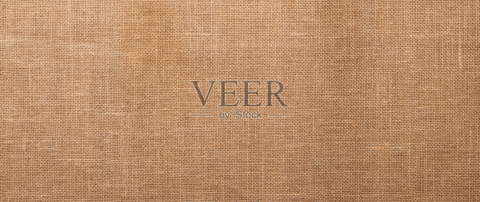 黄麻花纹，粗麻布纹理，帆布粗布，棕织土制布袋。天然粗麻米色纺织质感。亚麻织物背景。线程的背景。麻布表面，材质。照片摄影图片