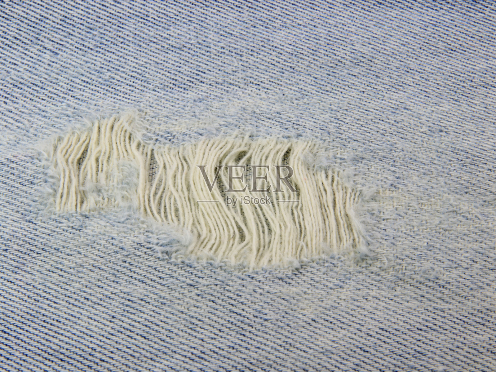 面料由牛仔裤的缝纫缝线构成背景纹理。照片摄影图片