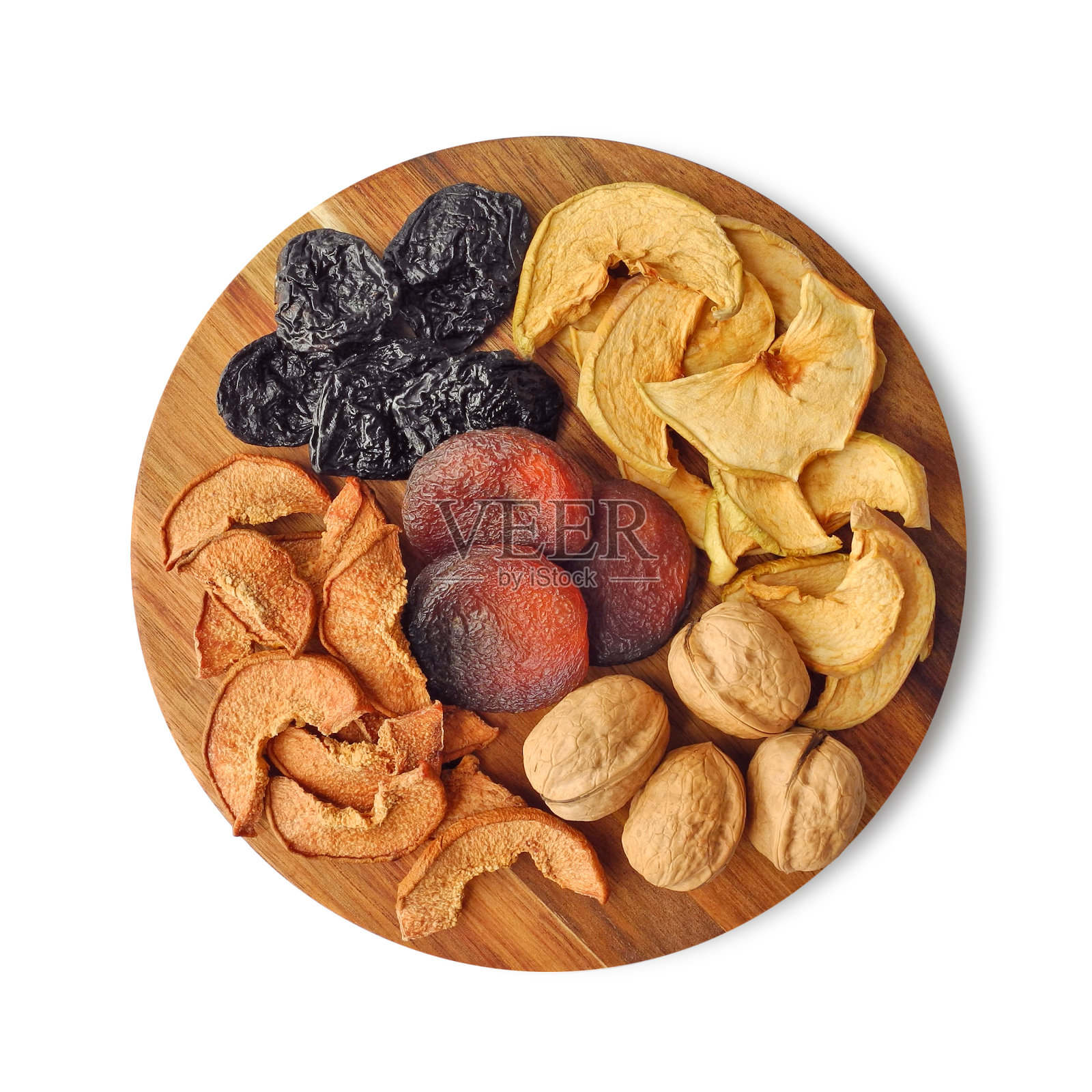 干果和坚果作为健康的零食，放在白色的圆形木板上隔离照片摄影图片