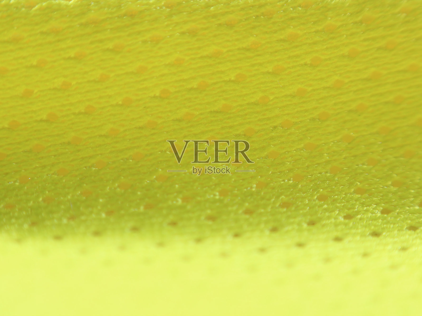 抽象的背景纹理黄色或橙色平滑的布与模糊的波浪。图像清晰地显示了纹理。照片摄影图片