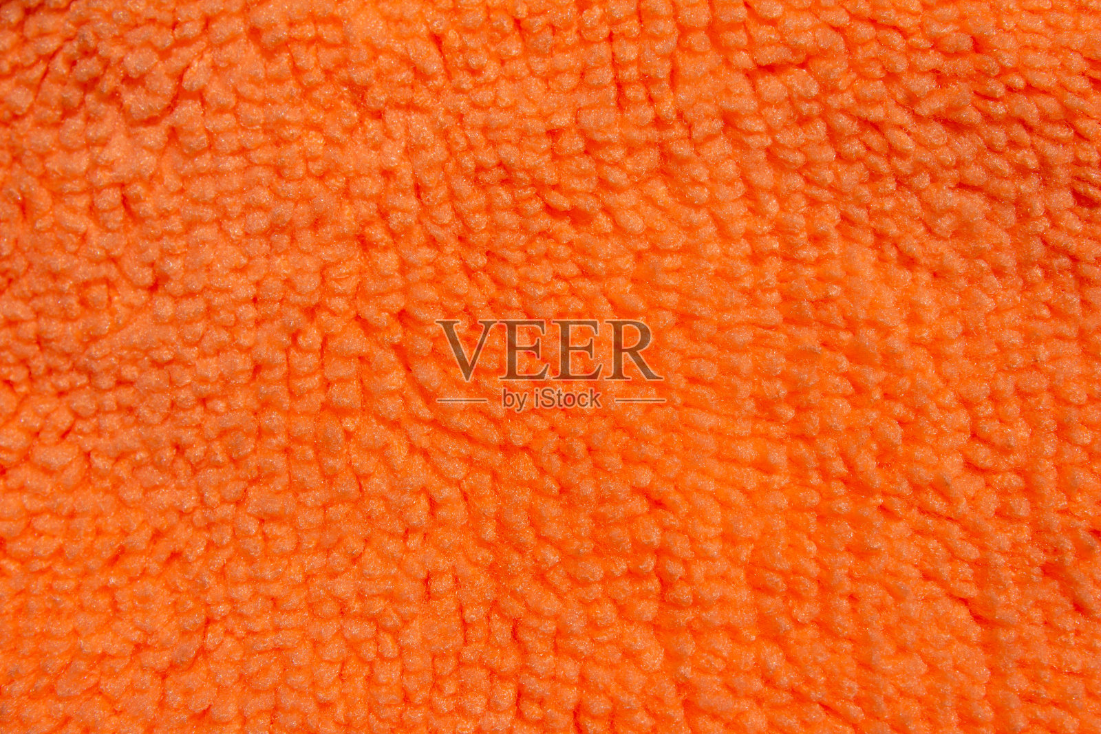 橙色织物纹理作为背景照片摄影图片