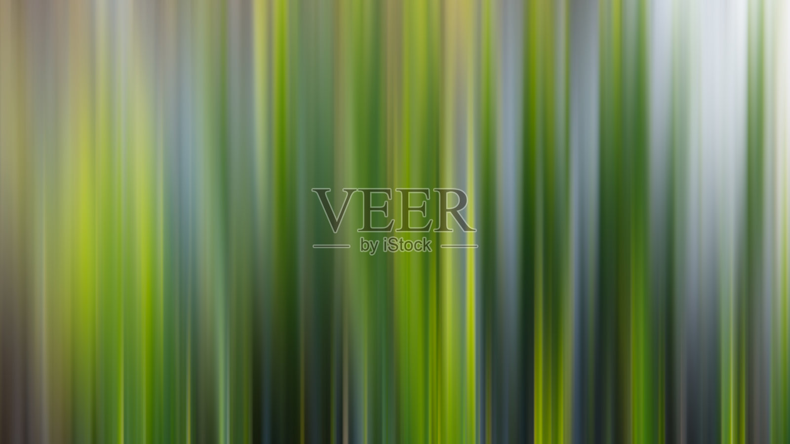 抽象模糊背景，竖线绿、黄、灰。照片摄影图片