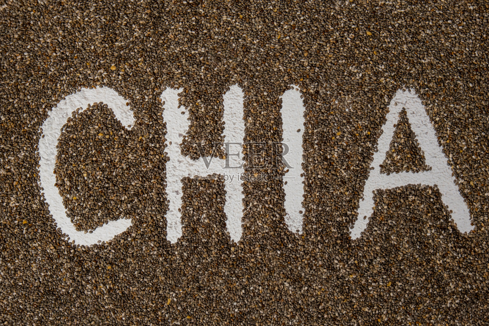 Word CHIA种子背景。富含Omega - 3脂肪酸的健康超级食物。干燥健康的天然成分。素食者最爱的饮食照片摄影图片