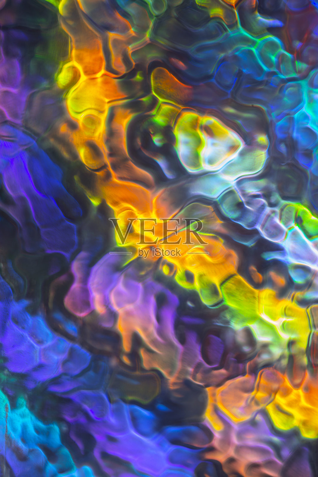 抽象生动的彩色图案。偏振光透过玻璃结构观看。动感缤纷的艺术背景。照片摄影图片