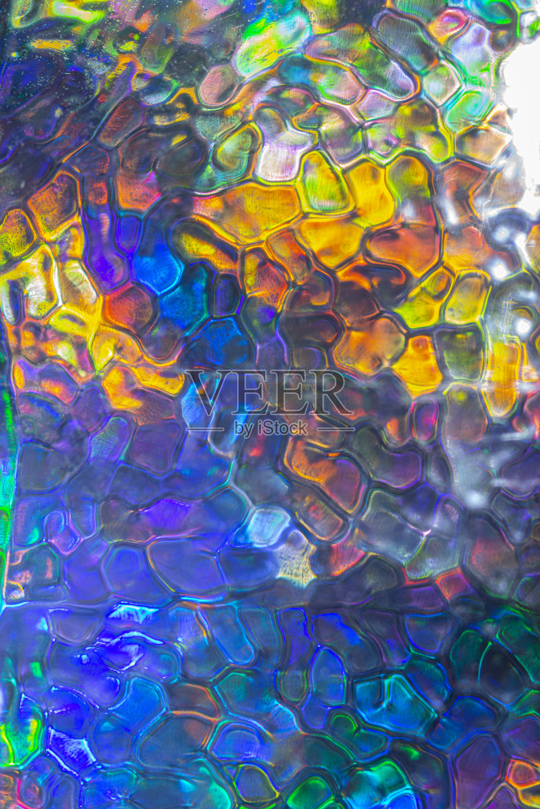 抽象生动的彩色图案。偏振光透过玻璃结构观看。动感缤纷的艺术背景。照片摄影图片