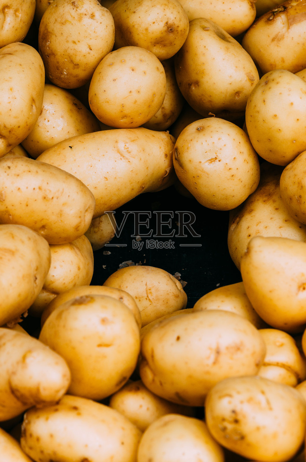 一堆新鲜的黄色土豆的特写镜头照片摄影图片