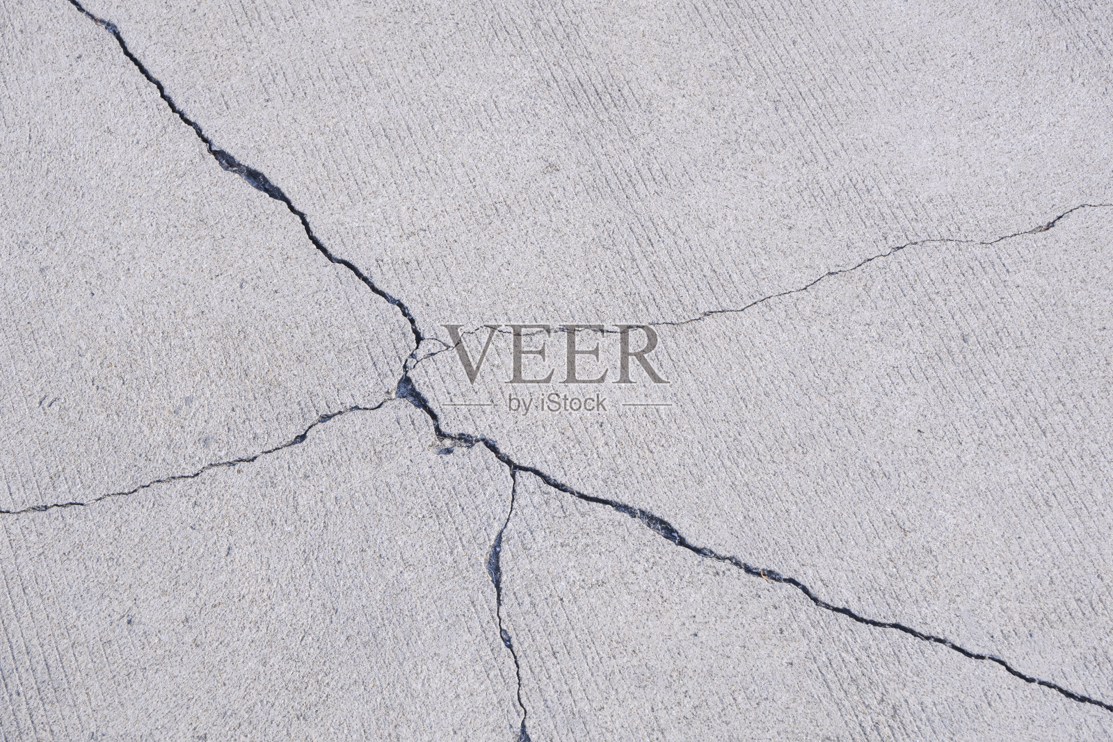 室外停车场区域内混凝土地面裂缝的背景和纹理照片摄影图片