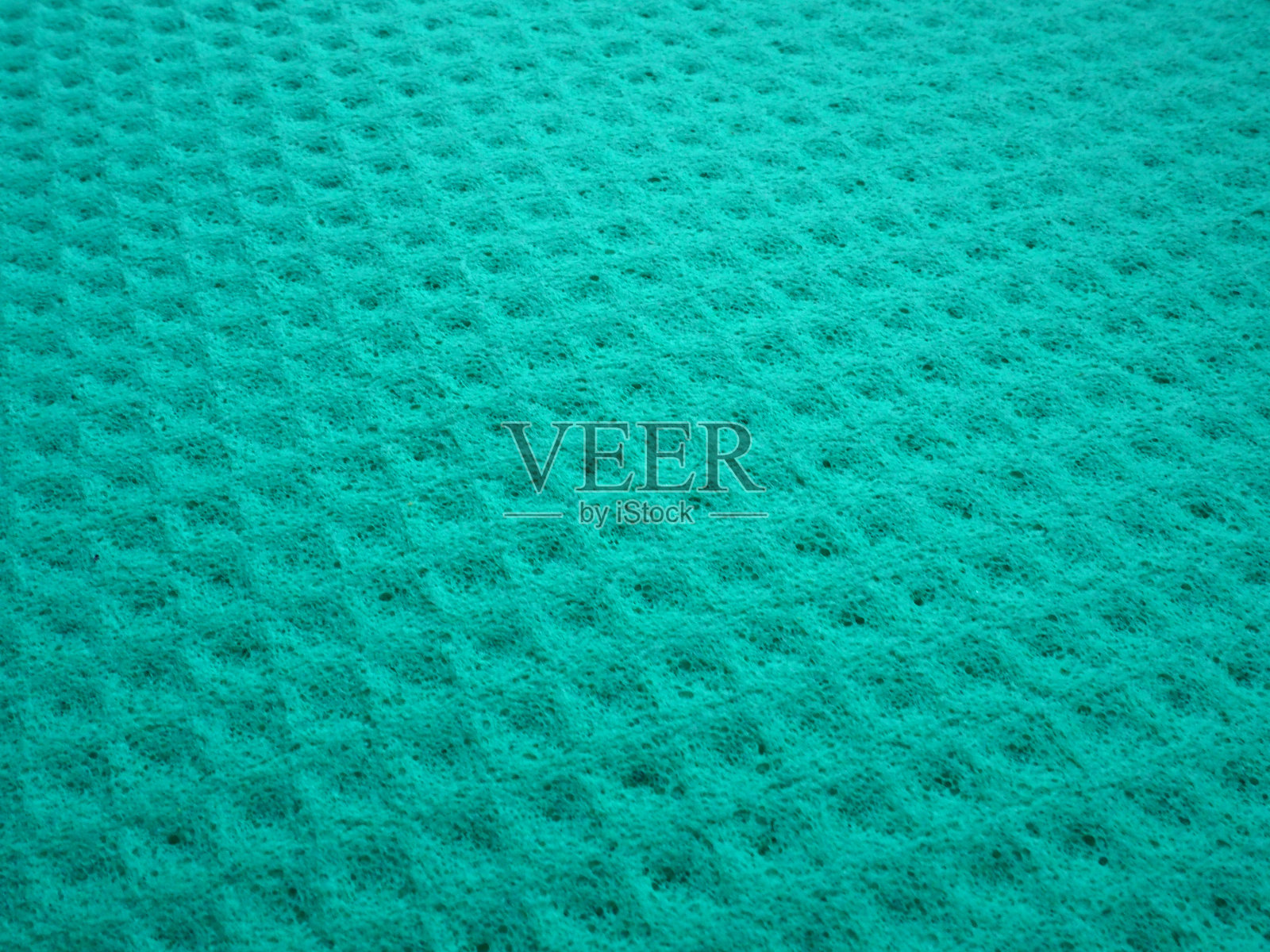 海绵纤维海绵纹理图案表面近景为绿色背景照片摄影图片