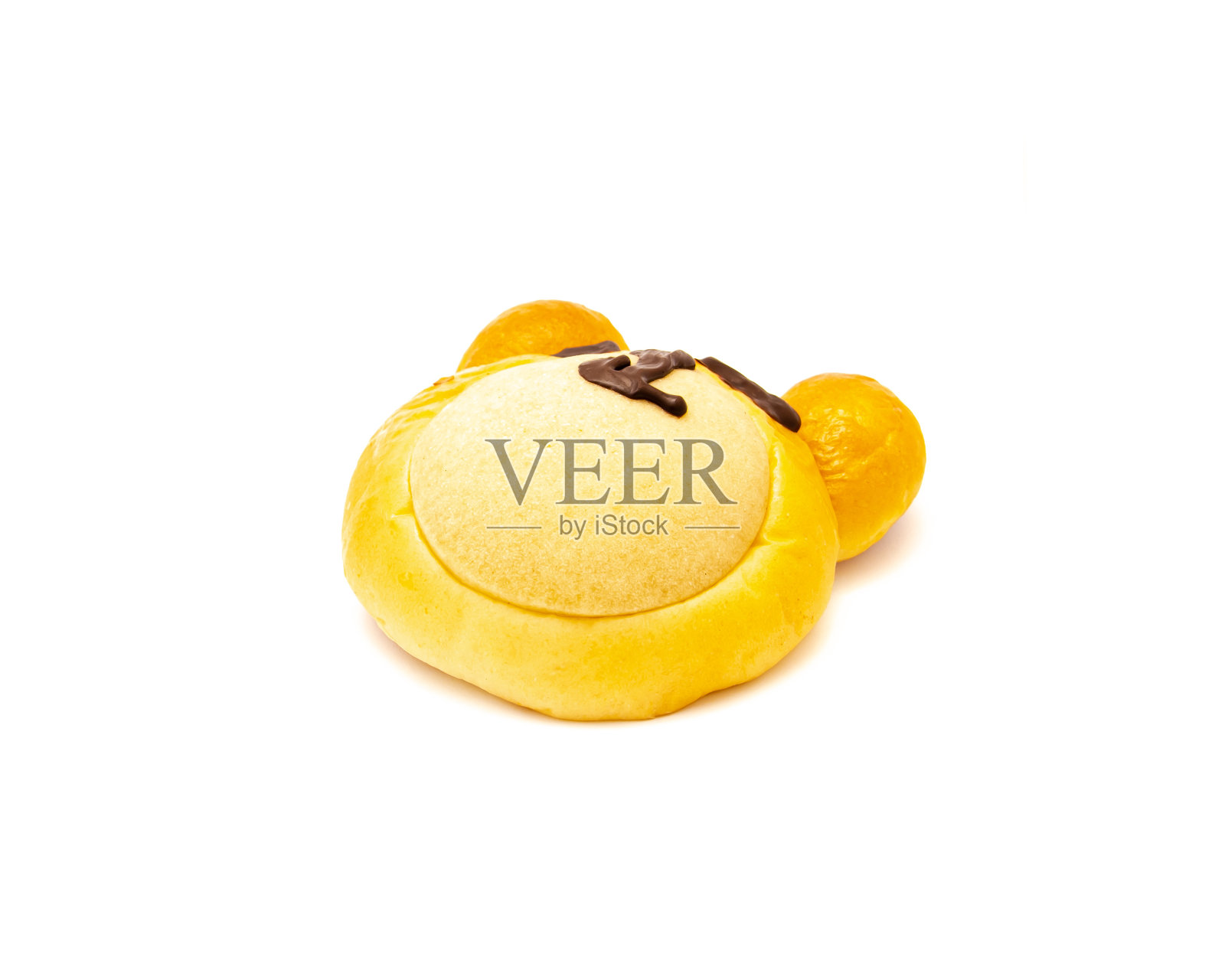 侧视图黄油和蓬松的熊面包与巧克力管有趣的熊脸孤立的白色背景照片摄影图片