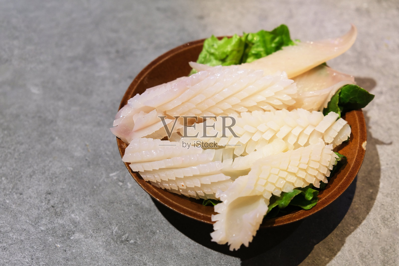 生鱿鱼卷。生海鲜配料照片摄影图片