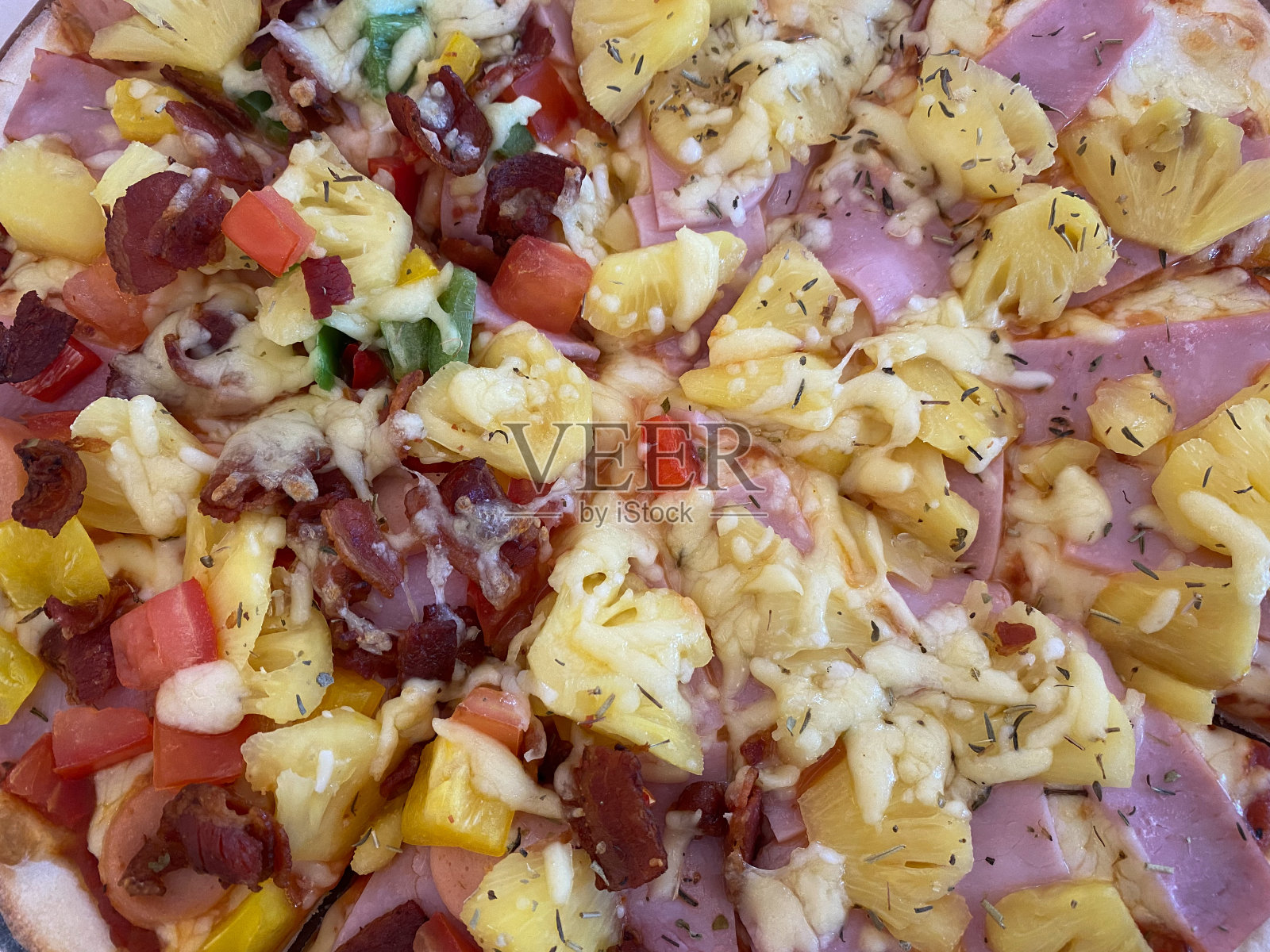 整个夏威夷菠萝火腿披萨照片摄影图片