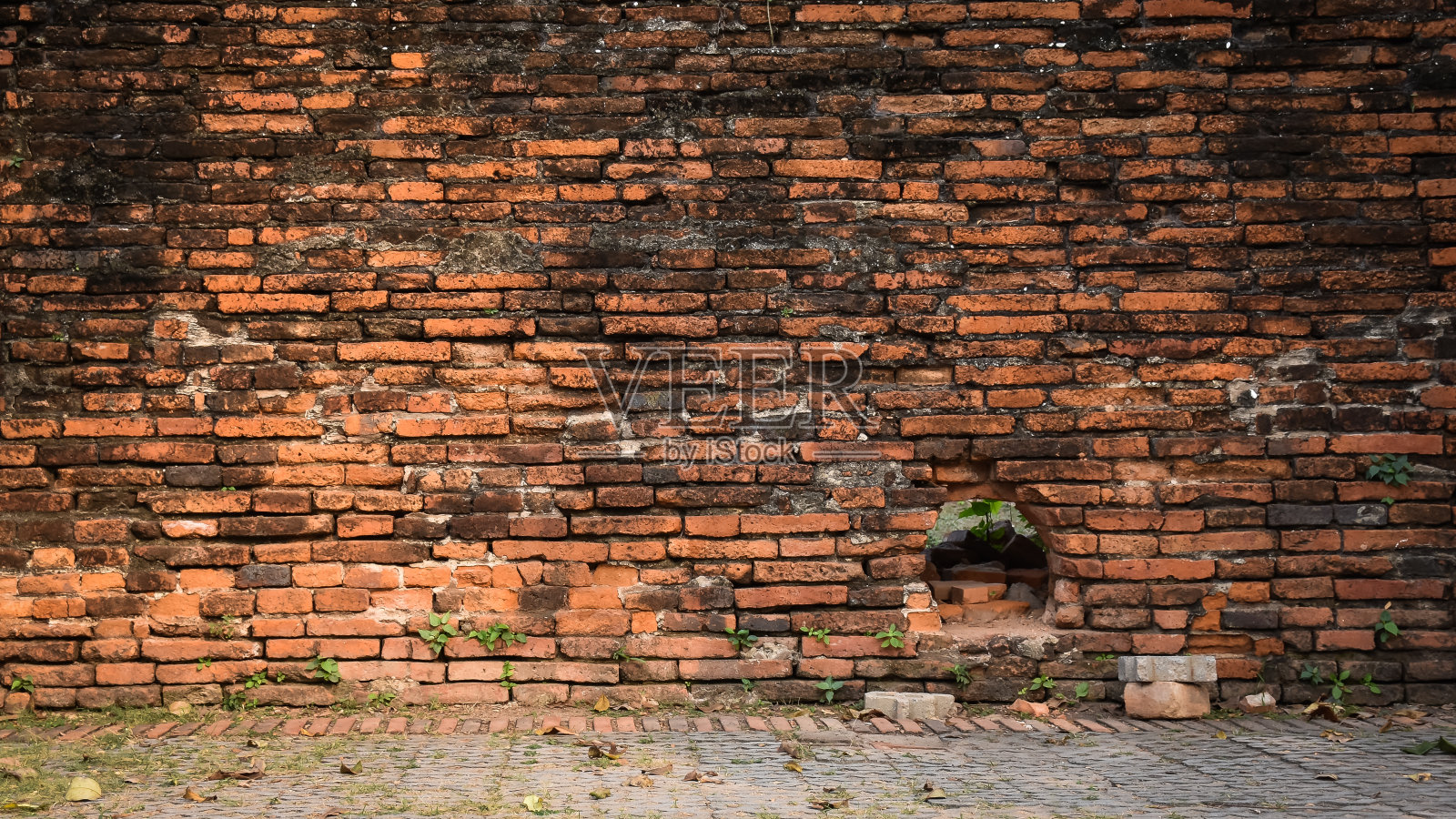 古砖墙作为背景。照片摄影图片
