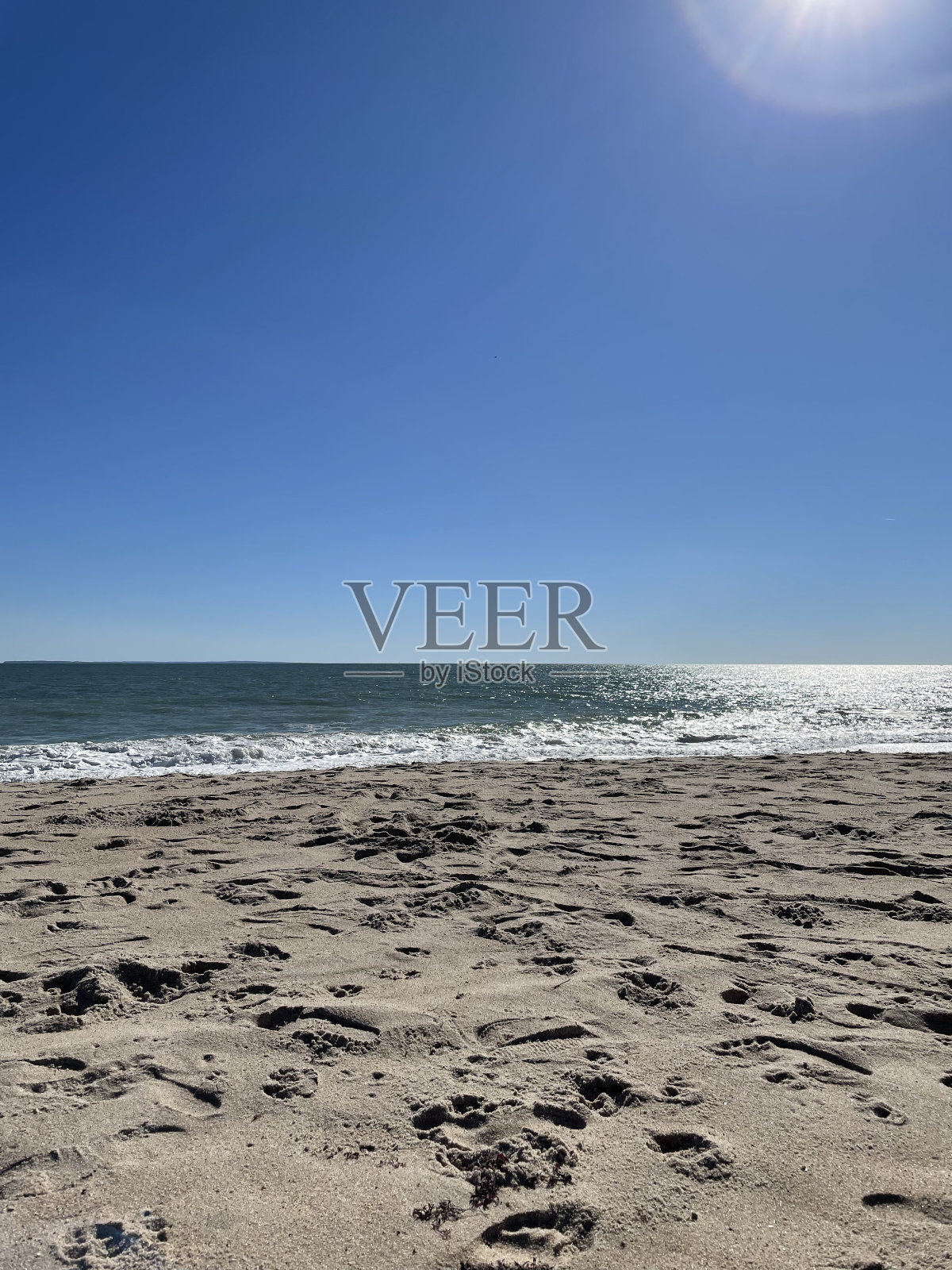 沙滩上的脚印照片摄影图片