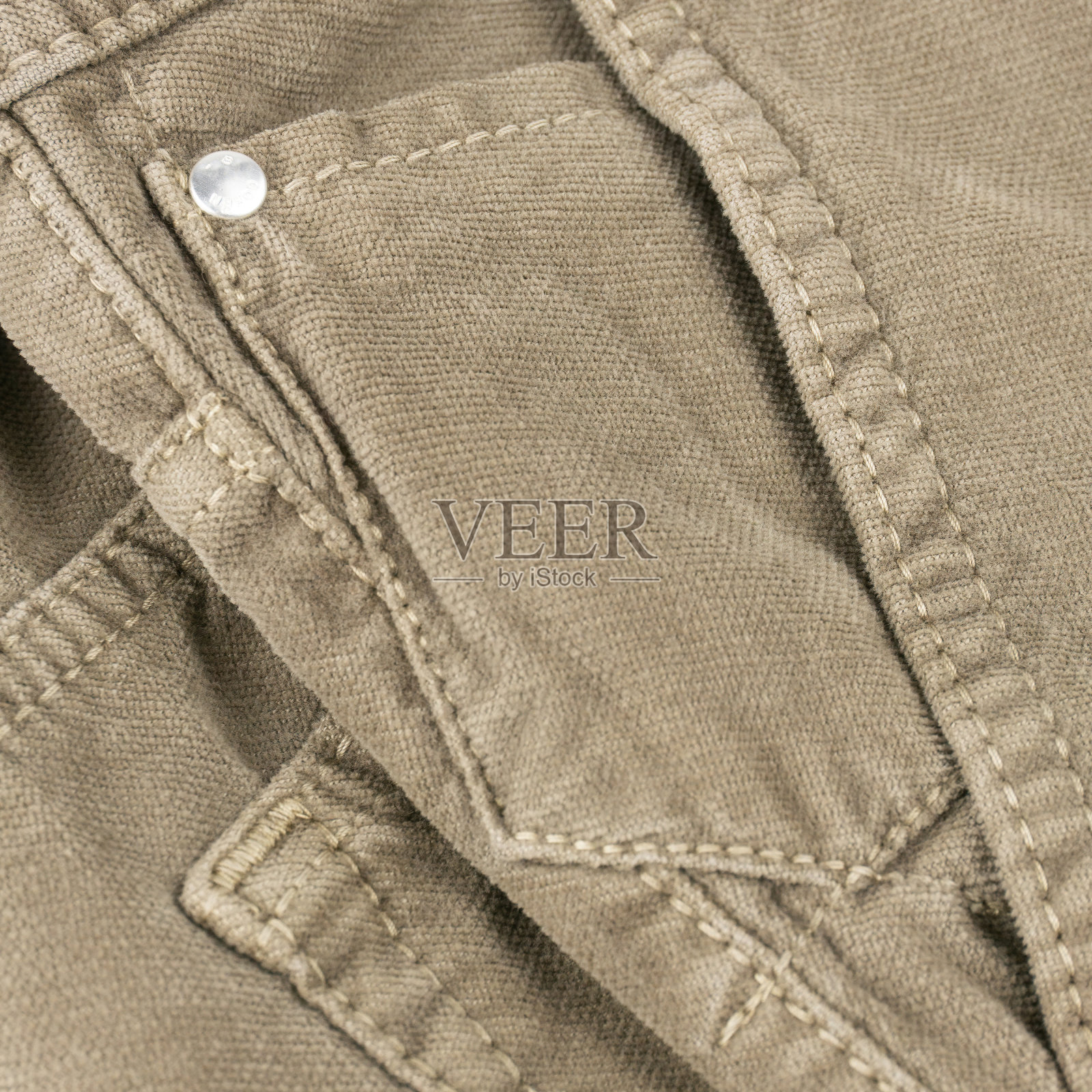 米色代表天鹅绒裤子和口袋细节照片摄影图片