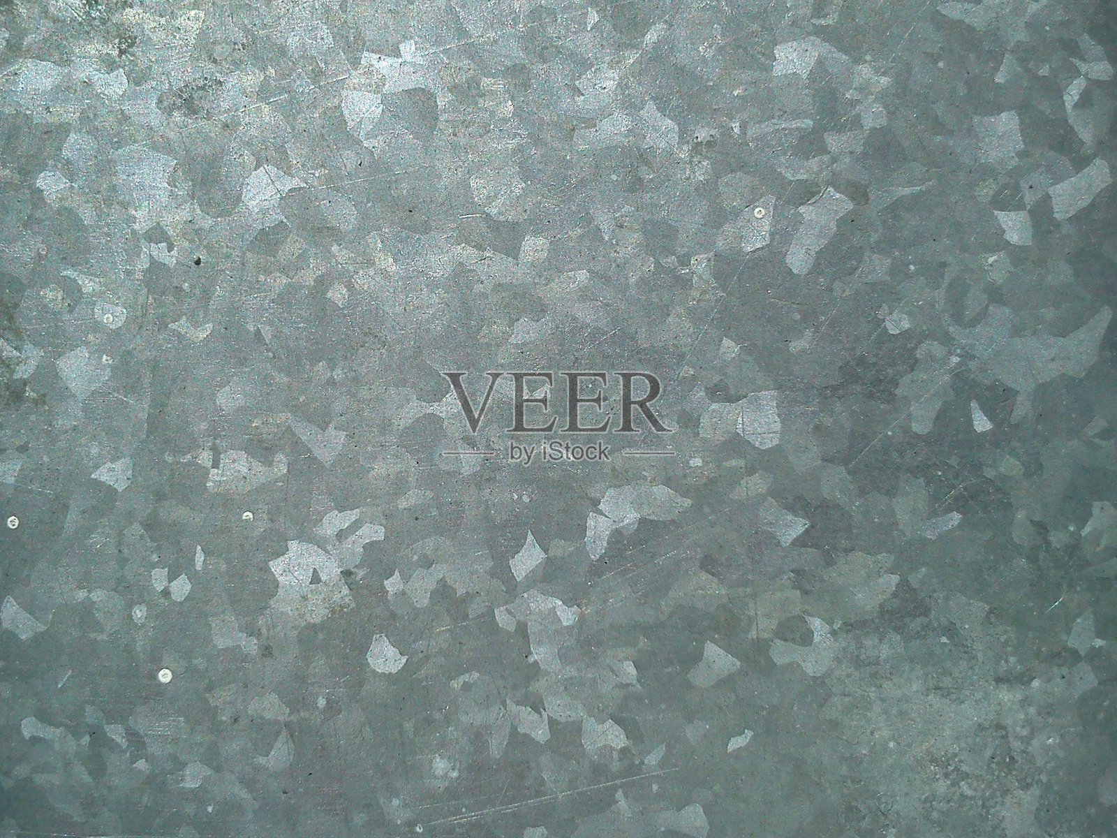 镀铬的灰色铝，有明亮的斑点，在阳光下闪闪发光照片摄影图片