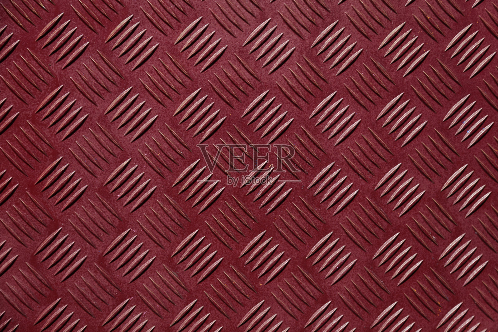 带有鱼骨或菱形花纹的红色工业板照片摄影图片