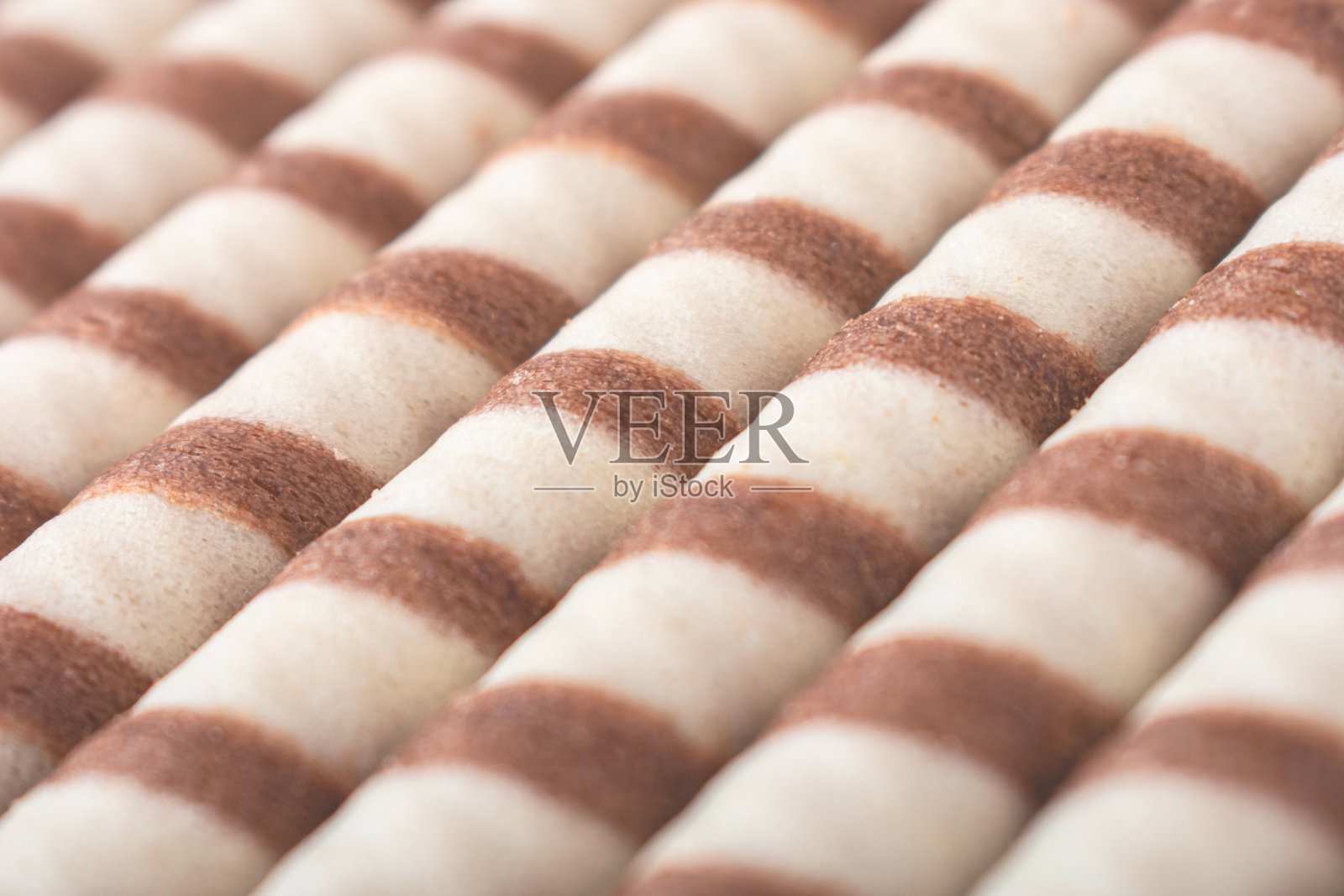 可口的威化卷棒为背景，俯视图。酥脆的食物照片摄影图片