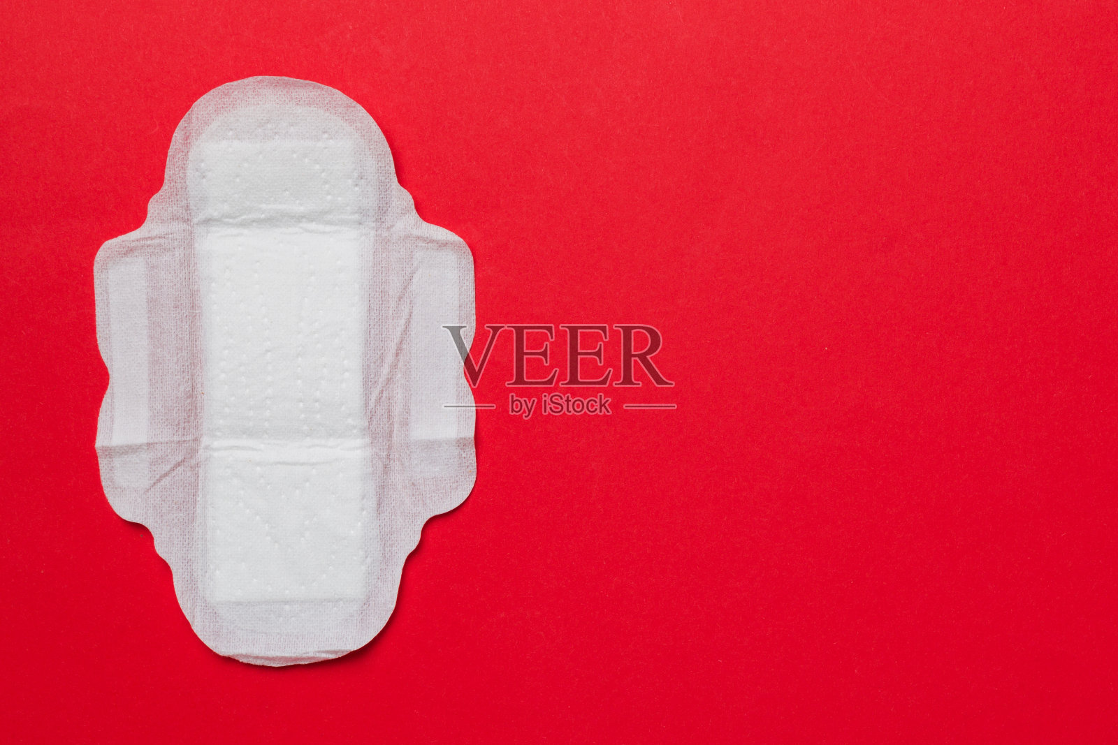 彩色背景的女性卫生用品或卫生巾。柔和的颜色。特写镜头。文本的空白位置。女性日常卫生照片摄影图片