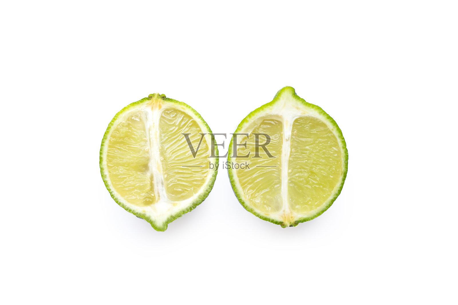 成熟的酸橙在白色的背景上。照片摄影图片