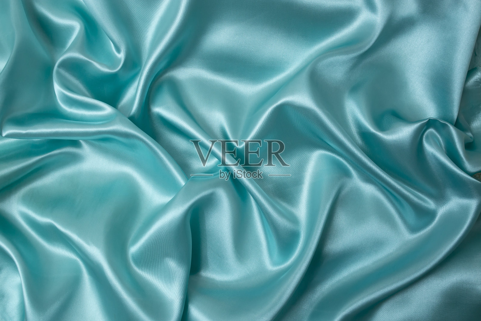 绿松石缎织物折叠，抽象的背景产品展示照片摄影图片