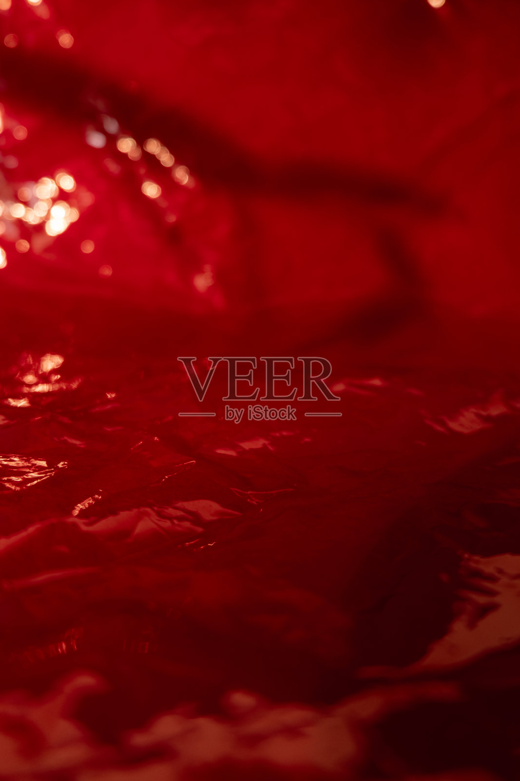 薄膜纹理红色叠加褶皱包裹散景光照片摄影图片