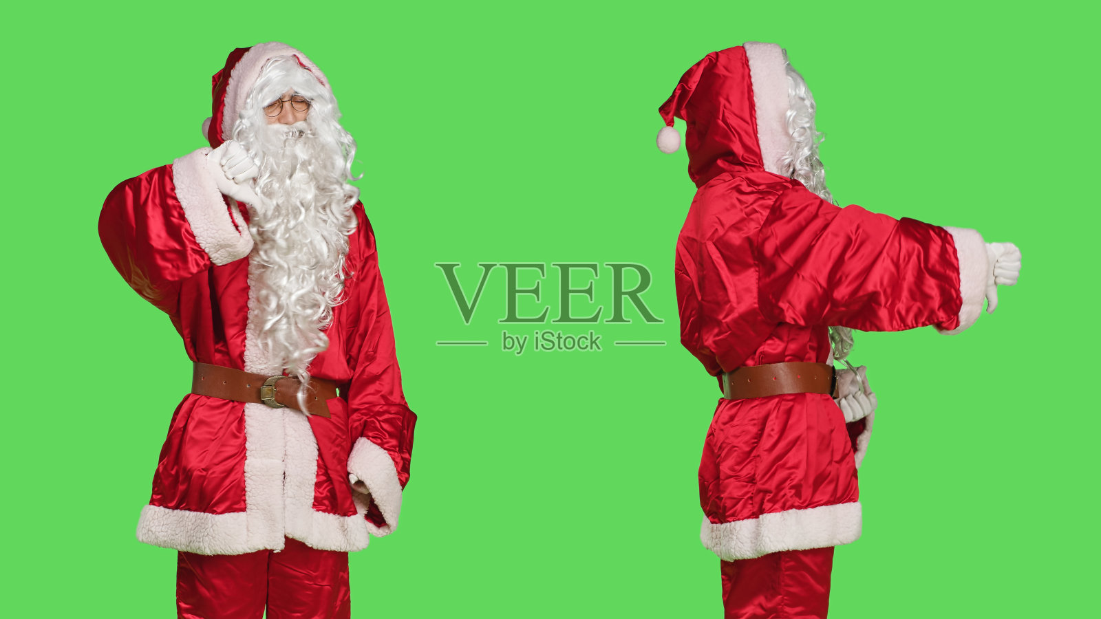 圣诞老人在摄影棚竖起大拇指照片摄影图片