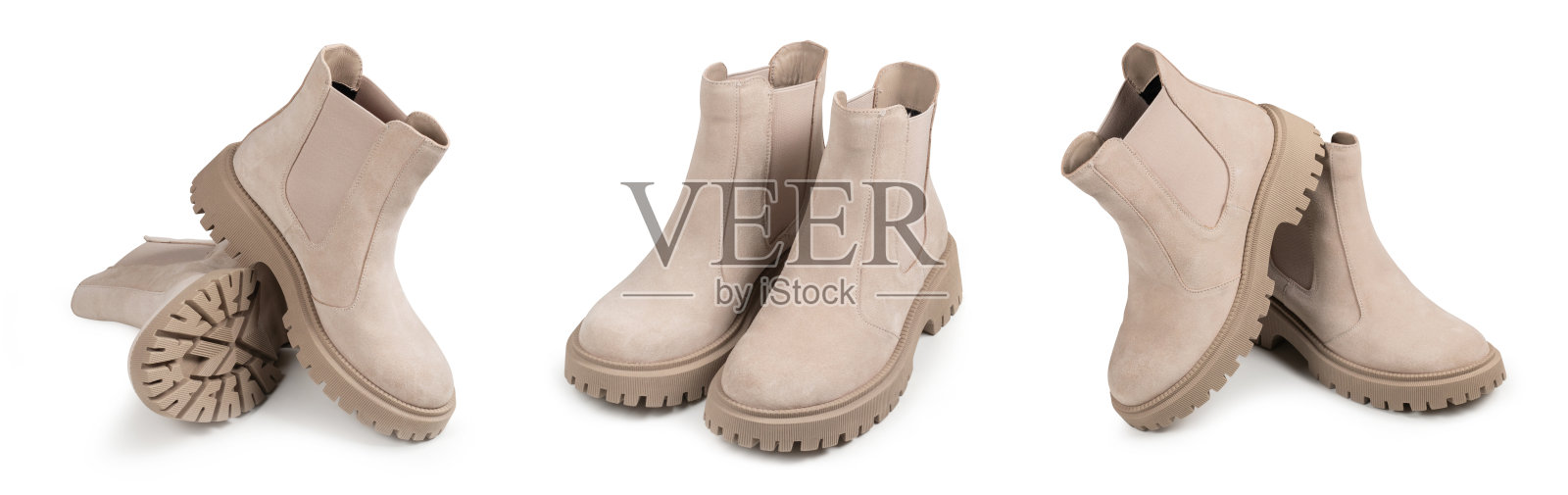 一双白色底色麂皮女式半筒靴。时尚的半季女鞋。照片摄影图片