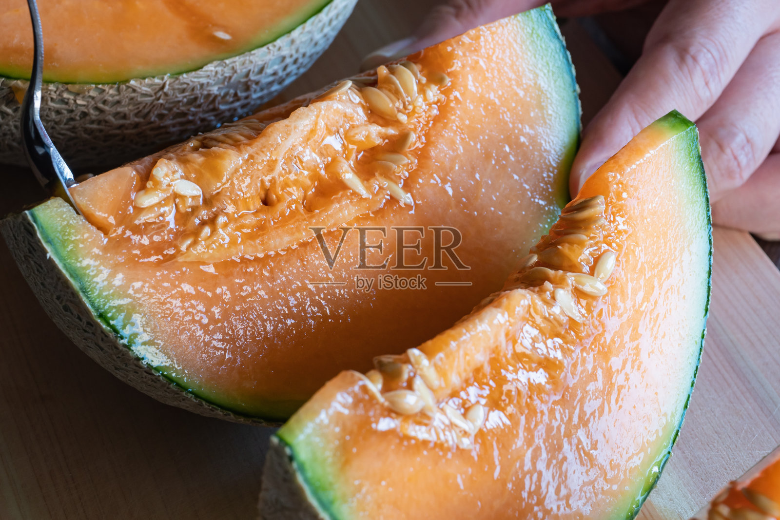 说瓜。香甜可口的橙色水果。照片摄影图片