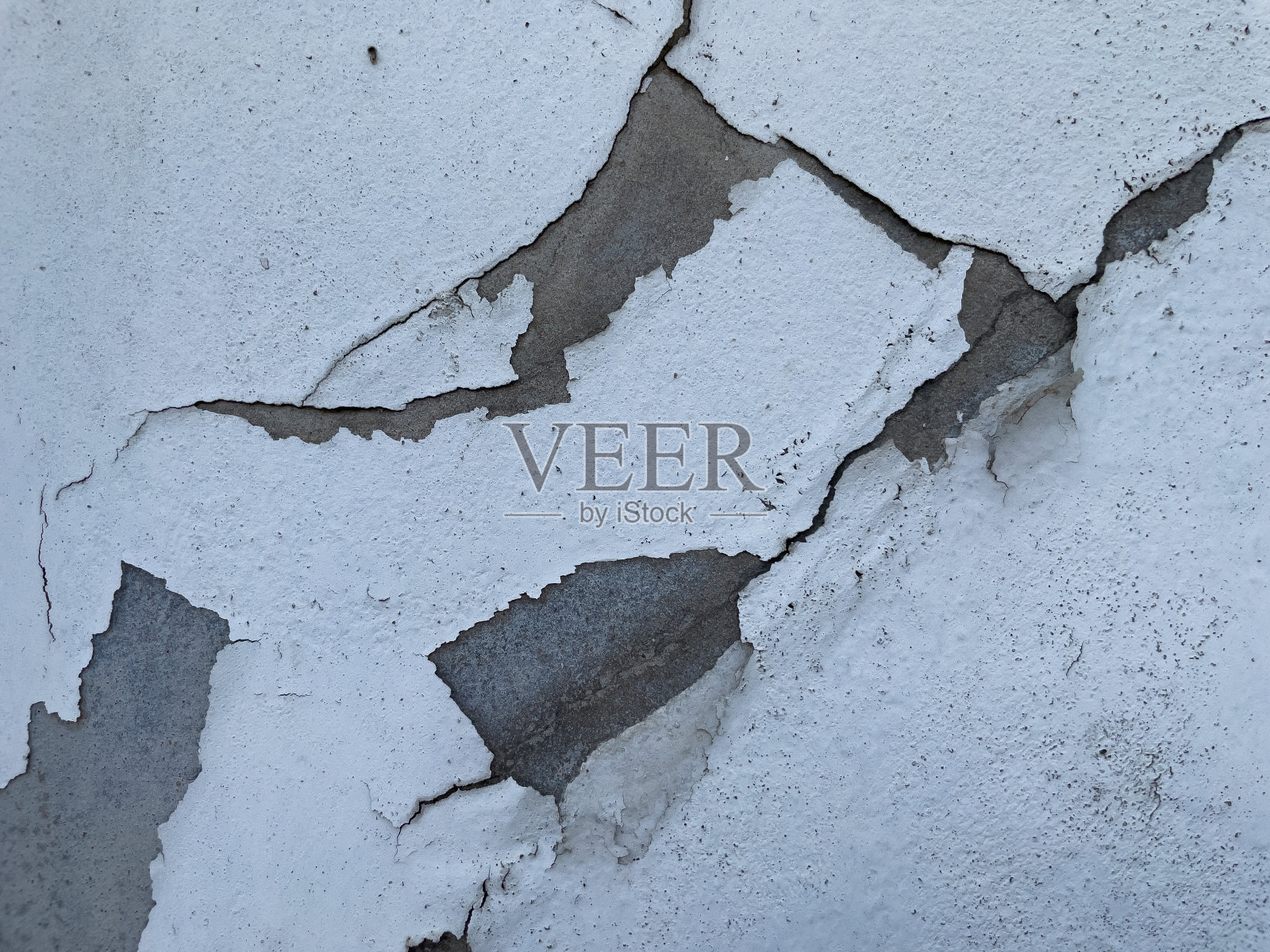 开裂墙面纹理的特写镜头。照片摄影图片