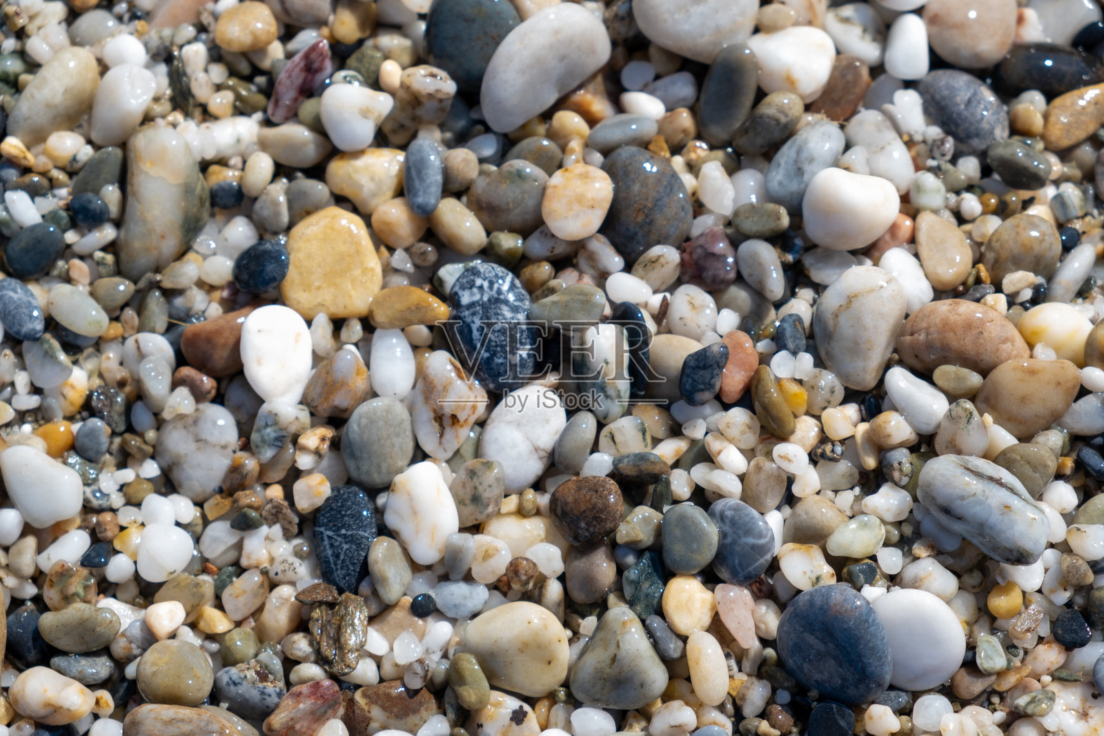 海边或花园里的小鹅卵石和石头的背景照片摄影图片