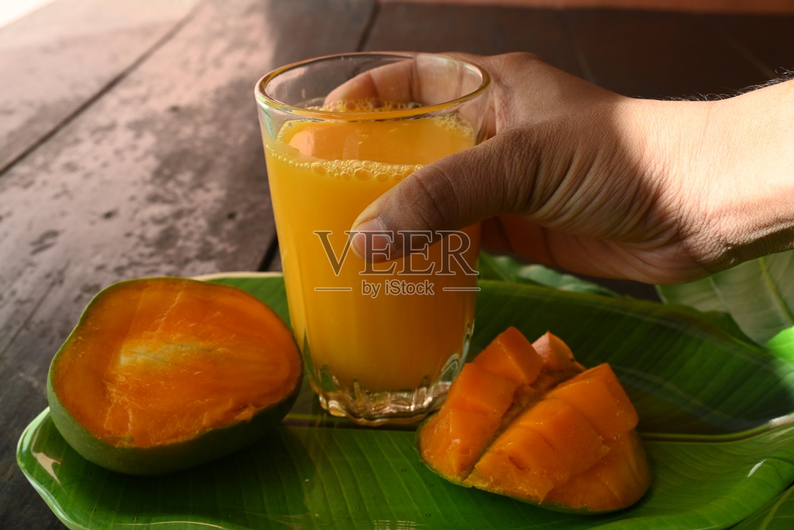 芒果汁。照片摄影图片