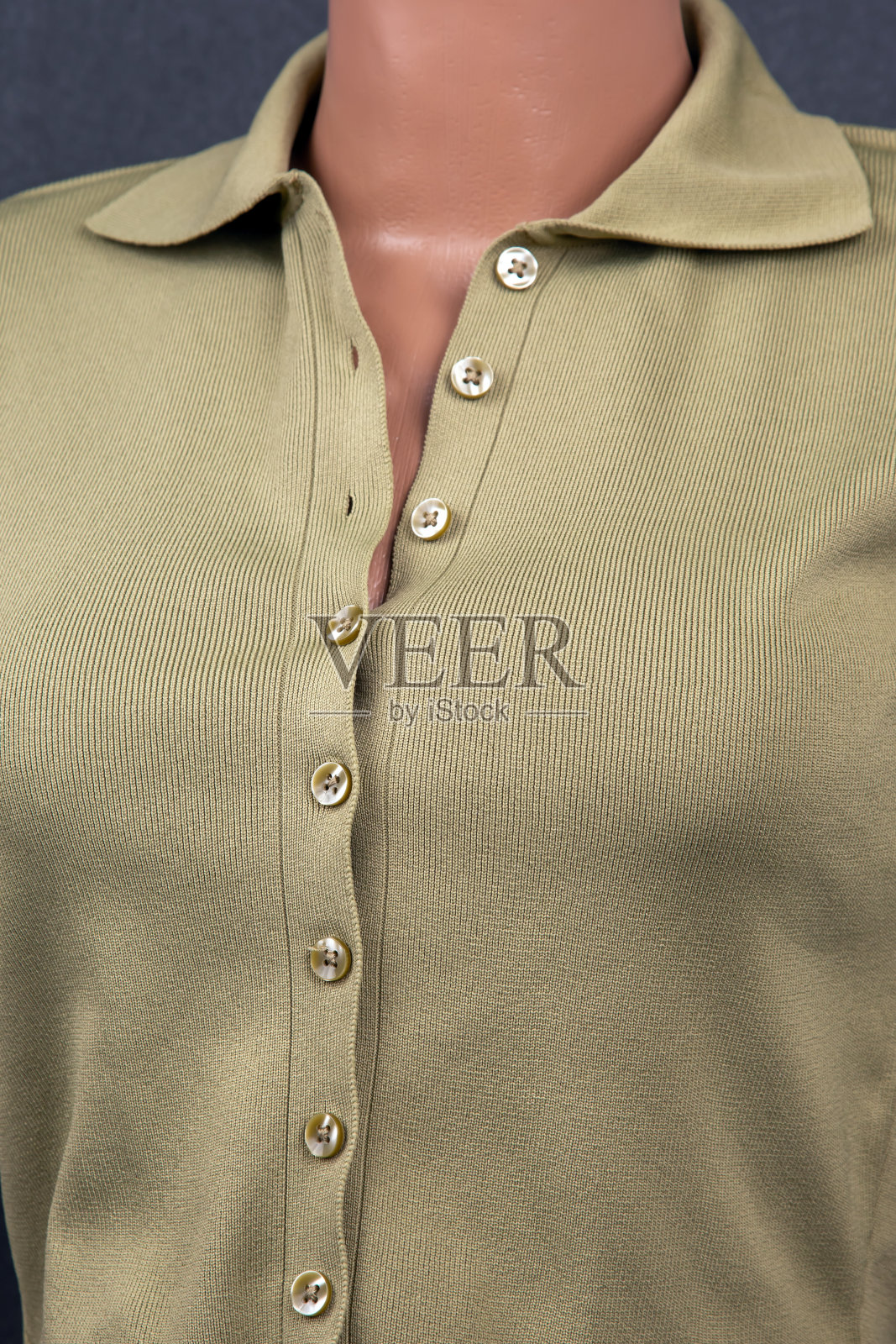 女夹克与珍珠母钮扣。服装的风格和时尚。纺织工业。照片摄影图片