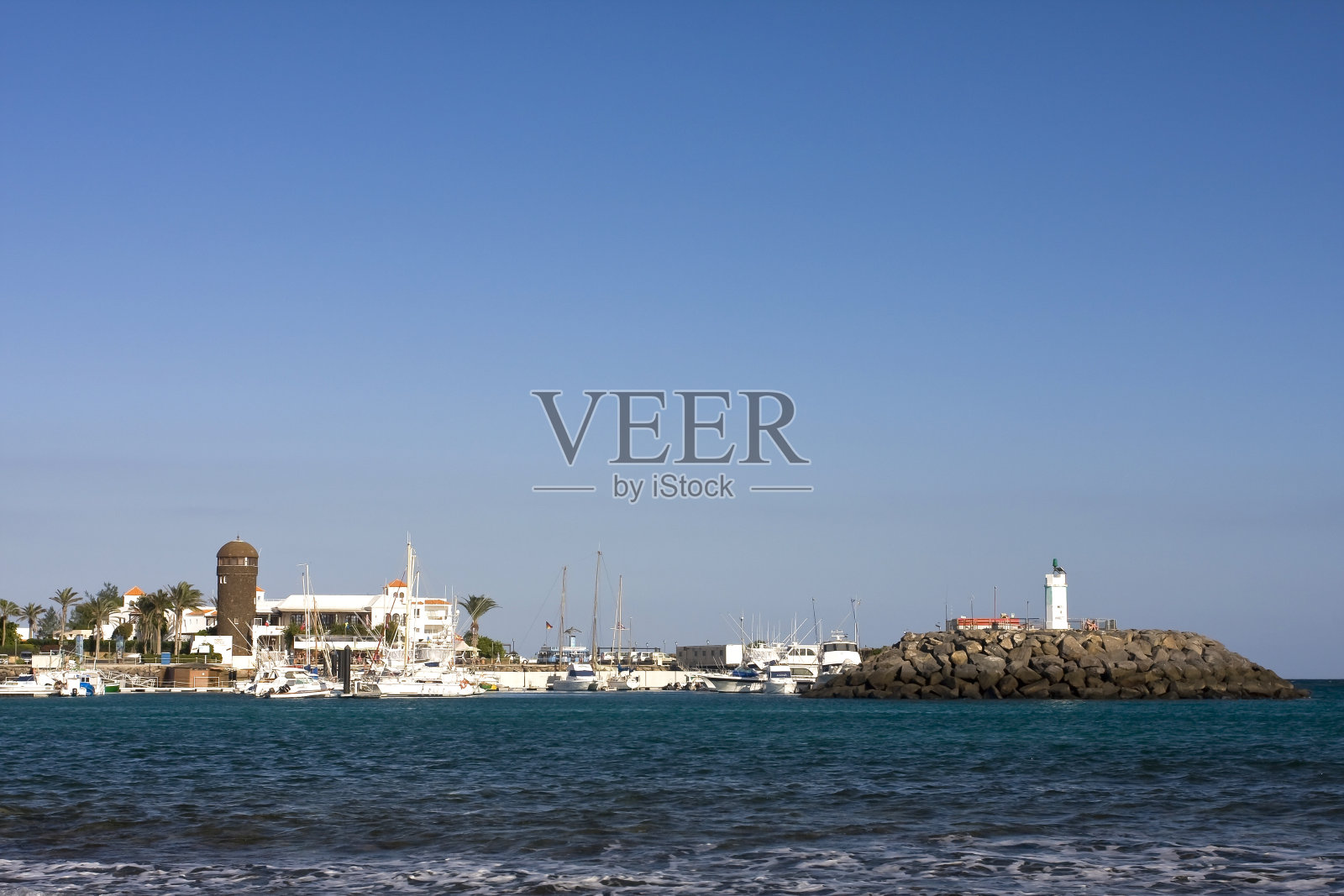 欧洲西班牙加那利群岛富埃特文图拉卡莱塔德福斯特的灯塔码头照片摄影图片