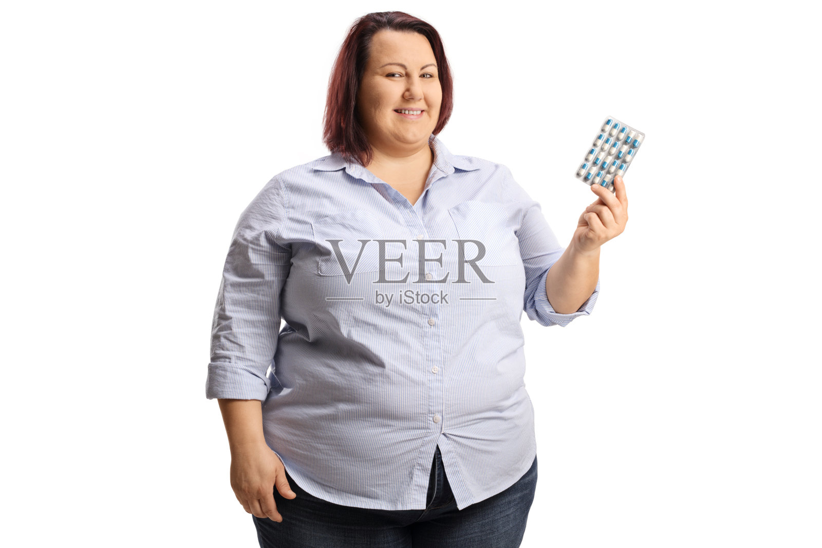 一个拿着一包药片的超重女人照片摄影图片