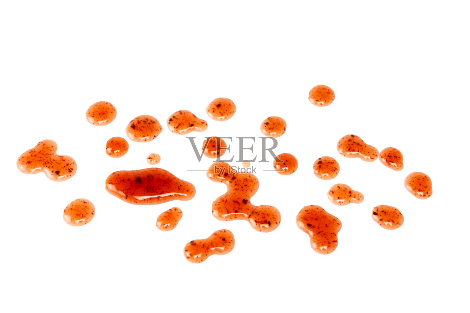 红色的果酱溅在白色的背景上。照片摄影图片