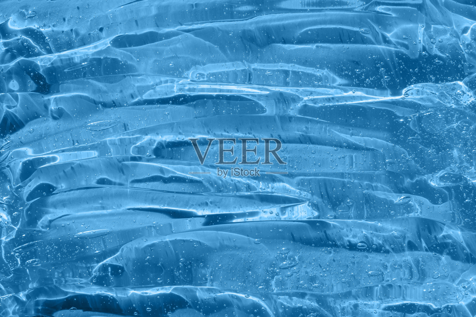 化妆品血清涂片样本胶原蛋白和多肽。美容护肤品的质地。乳剂、抗衰老女性化妆品产品。皮肤护理凝胶透明样品带气泡。抗菌洗手液照片摄影图片