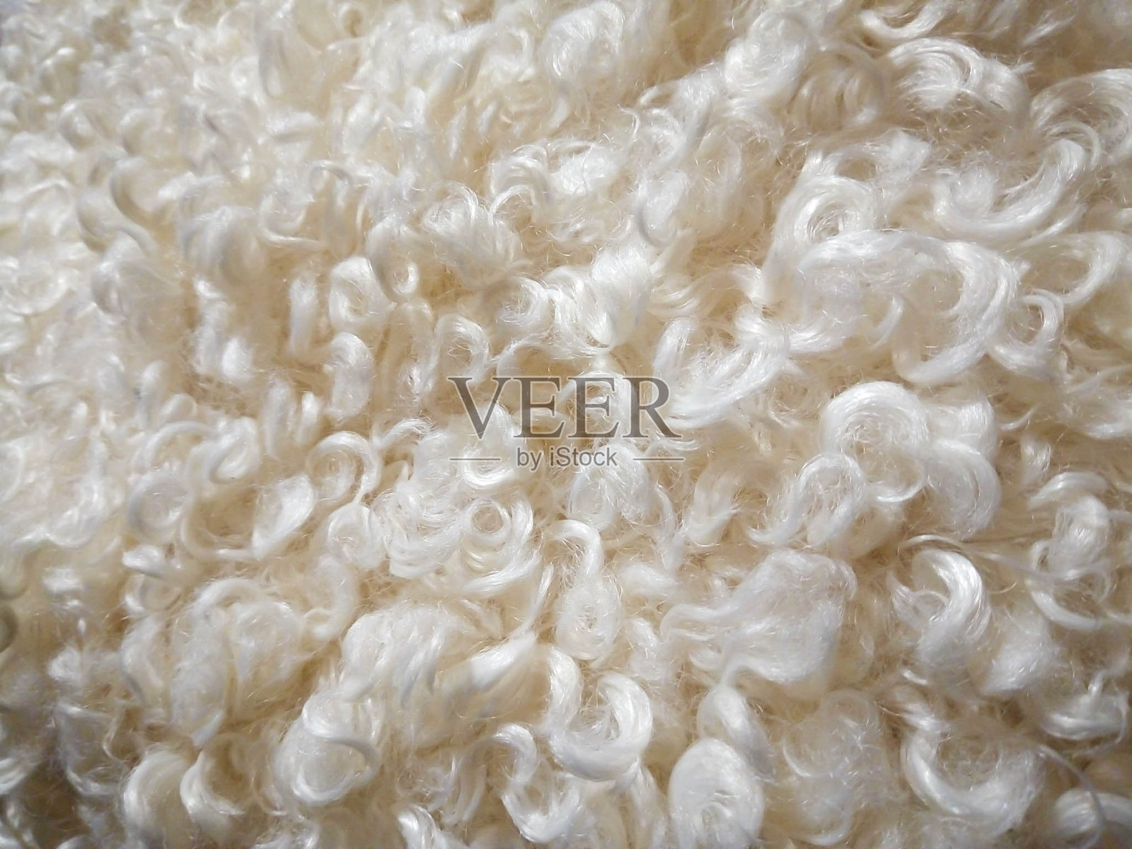 白色卷曲羊毛无缝纹理背景。人造羊毛照片摄影图片