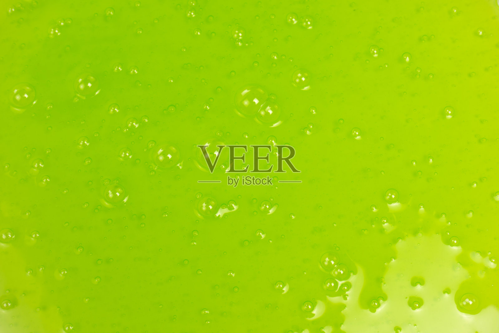 绿色黏液玩具作为背景。照片摄影图片