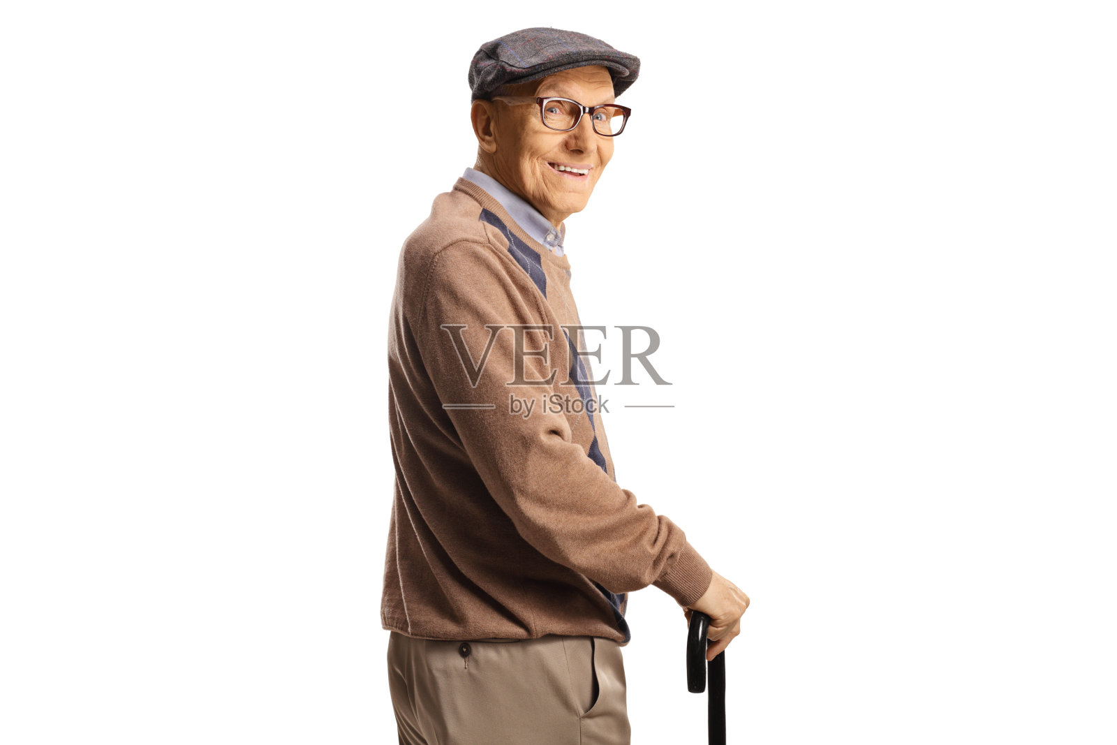 一个快乐的老人拄着拐杖回头看照片摄影图片