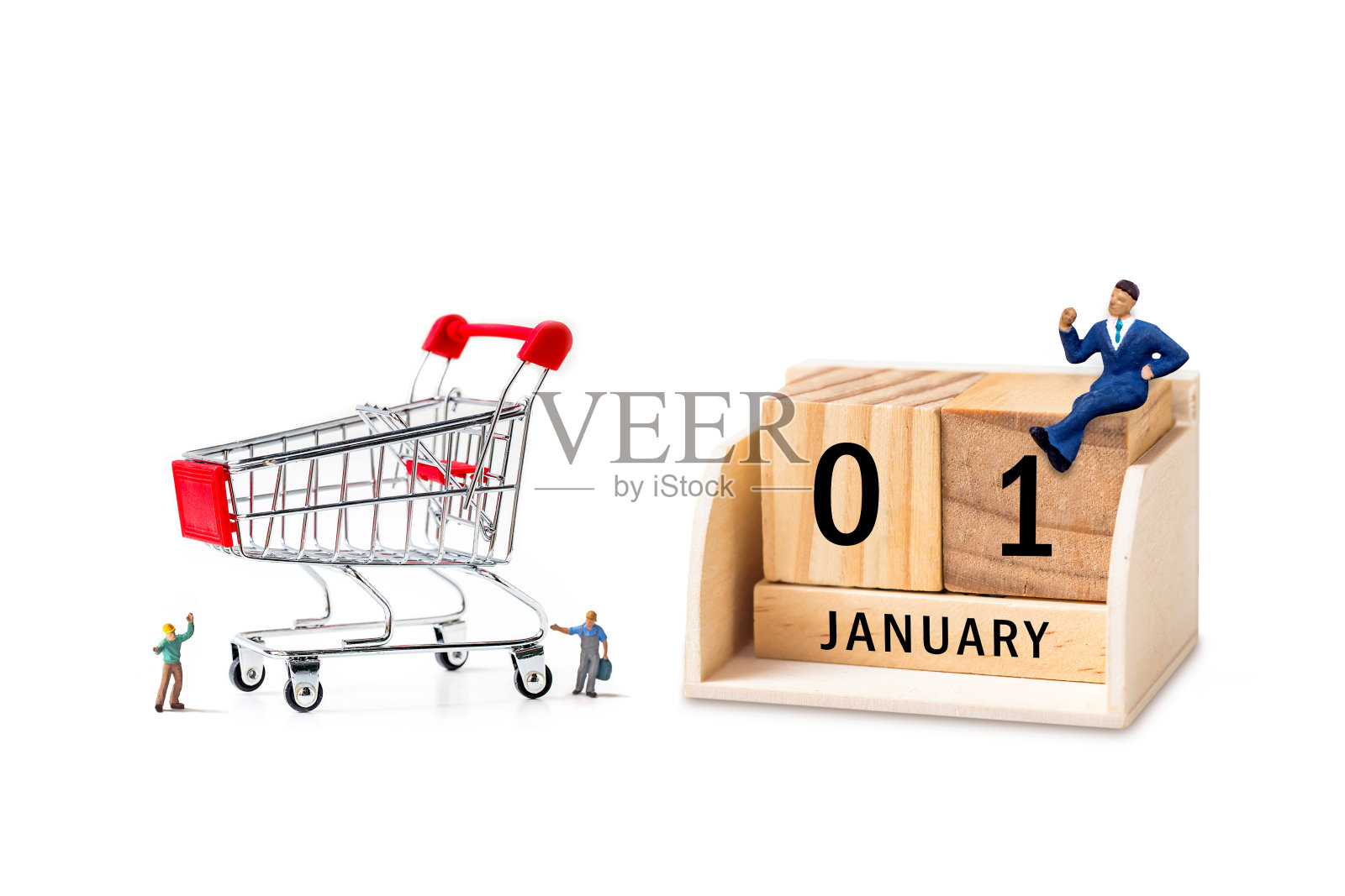 白色背景上有微型人物的木制日历照片摄影图片