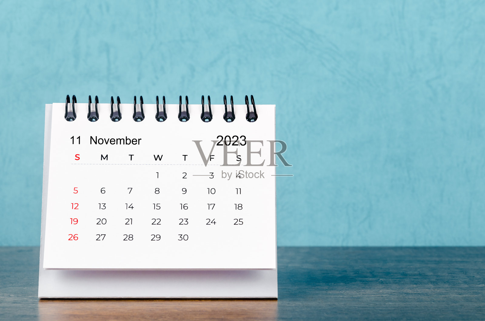 2023年11月台历，蓝色背景，复古风格。照片摄影图片
