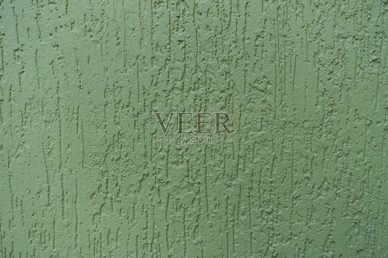 近距离拍摄的绿色墙壁与灰泥蠕虫完成照片摄影图片